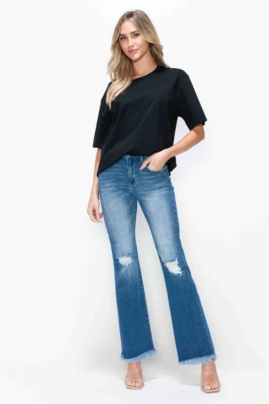 Bytos full size distressed high-rise bootcut jeans with raw hem, featuring a trendy, worn-in denim look.