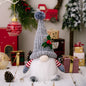 Faceless gnome figurine with short legs and light-up feature, designed by Trendsi, shown in a cozy home decor setting.