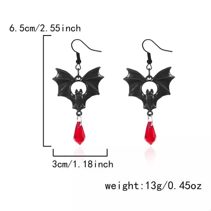 Gothic bat drop earrings with black metal bat design, trendy accessories for gothic fashion and dark style looks.
