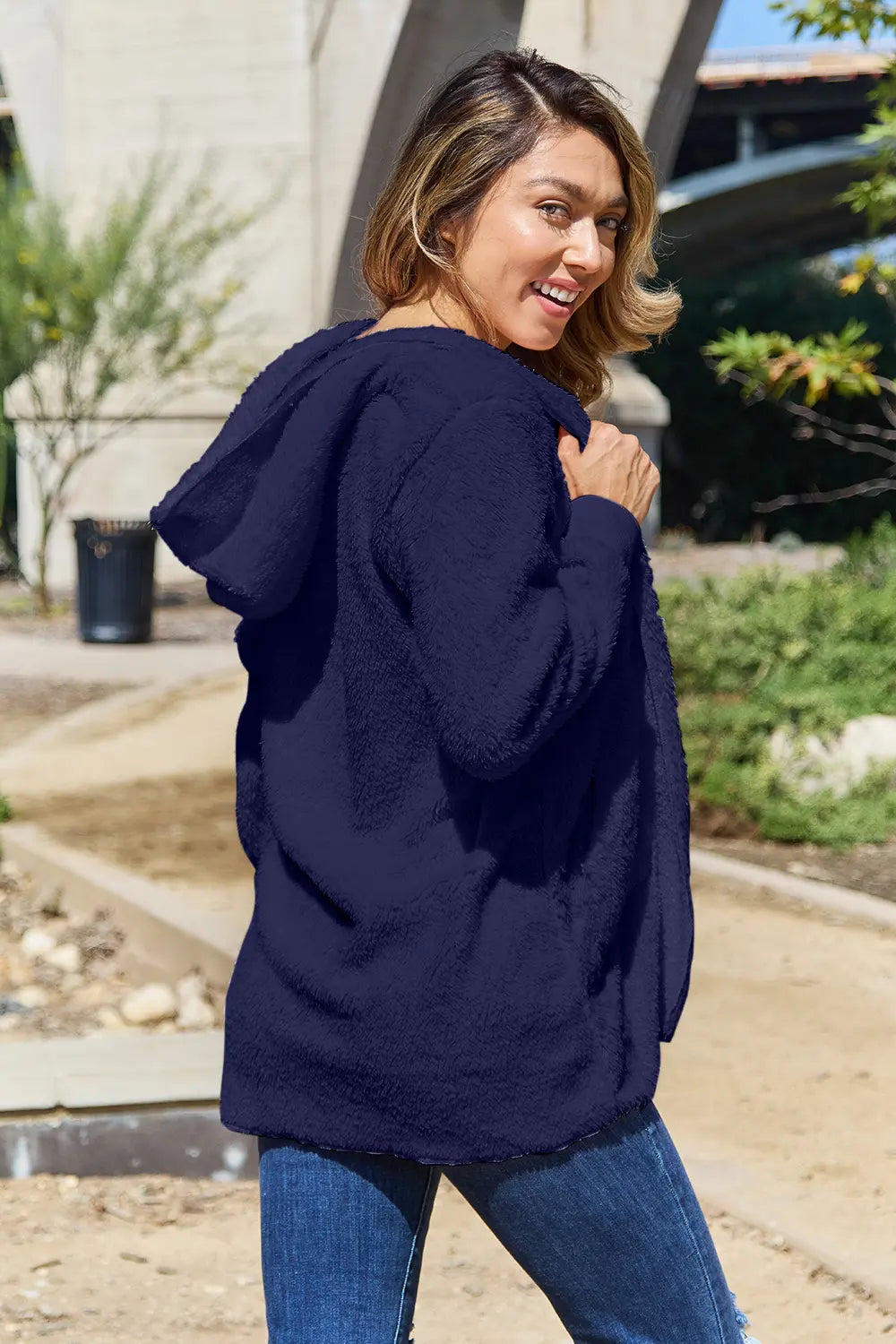 Full size Teddy hoodie jacket with front pockets, soft fleece material, Trendsi brand, cozy and stylish for cold weather.