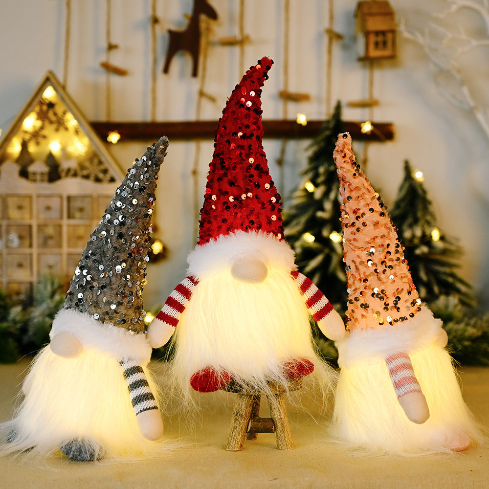 Sequin light-up faceless gnome figurine with shiny sequins and illuminated features, ideal for festive holiday decor.