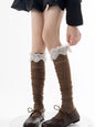 Lace over-the-knee hollow-out stockings by Trendsi, featuring intricate lace design and sheer, stylish thigh-high coverage.