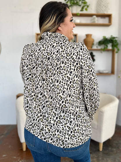 Plus size leopard print long sleeve blouse by Trendsi, featuring a full-size, stylish and comfortable women's top with a modern design.