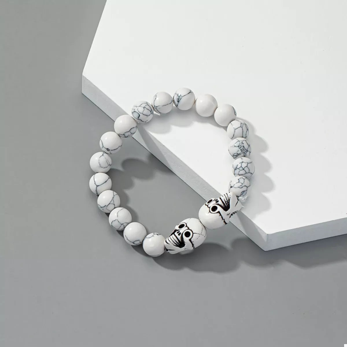 Halloween Skull Beaded Bracelet by Trendsi featuring black beads and a skull charm for spooky seasonal accessory adornment.