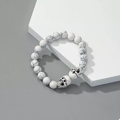 Halloween Skull Beaded Bracelet by Trendsi featuring black beads and a skull charm for spooky seasonal accessory adornment.