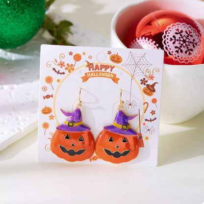 Halloween pumpkin dangle earrings with orange and black design, featuring festive pumpkin charms for holiday accessories.
