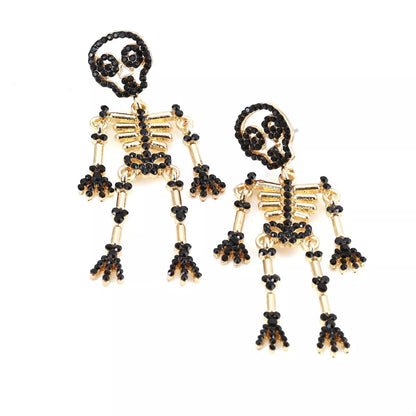 Halloween Skeleton Statement Earrings by Trendsi featuring spooky skeleton designs for Halloween-themed jewelry.