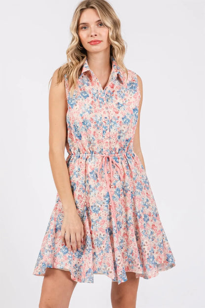 GeeGee floral eyelet sleeveless mini dress by Trendsi, featuring a full-size design with a vibrant floral pattern and eyelet details.