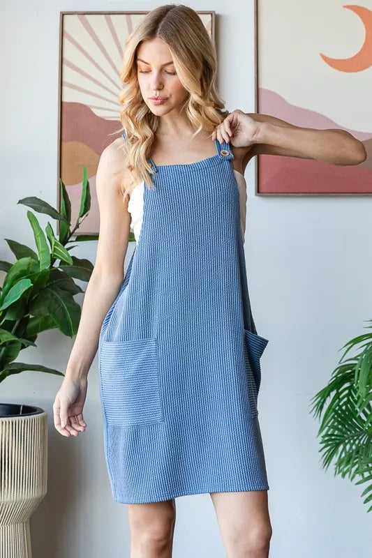 Heimish full size ribbed sleeveless mini tank dress in plus size, featuring a fitted silhouette and casual style.