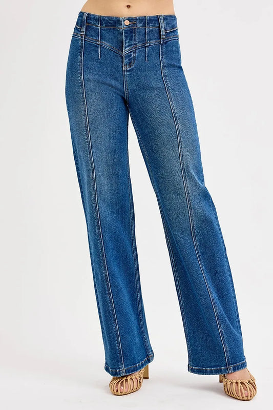 Risen wide leg jeans with seam details, featuring a relaxed fit and classic denim look, displayed on a model.