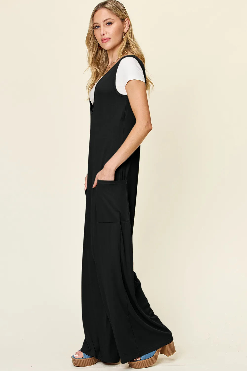 Plus size Trendsi Double Take sleeveless wide-leg jumpsuit with pockets, full length, and comfortable fit in a stylish design.
