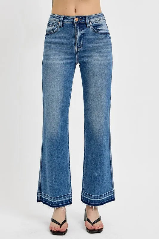 Plus size RISEN raw hem ankle bootcut jeans by Trendsi, showcasing the full length, raw hem detail, and classic denim fit.