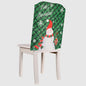 Christmas chair cover by Trendsi, festive red and green fabric with holiday-themed patterns, designed to fit standard chairs.