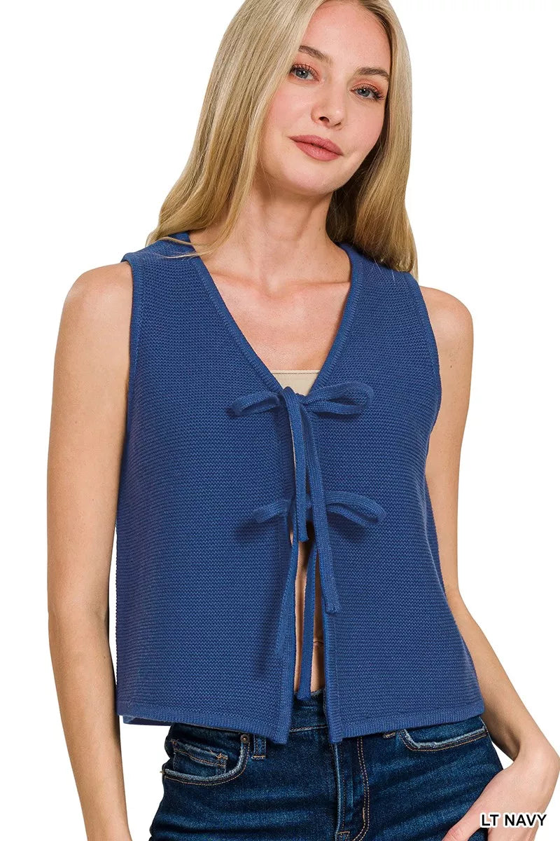 Tan Zenana tie front sweater vest with ribbed hem and V-neck design, styled with a white shirt underneath.
