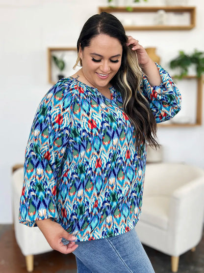 Printed balloon sleeve blouse from Trendsi featuring a double take full-size design and stylish balloon sleeves.