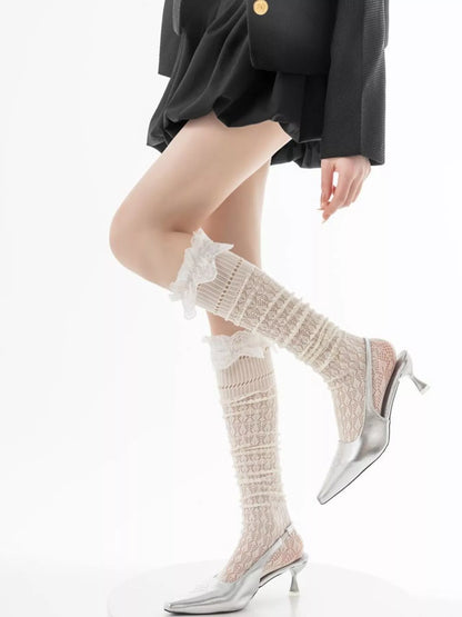 Lace over-the-knee hollow-out stockings by Trendsi featuring intricate lace design and sheer fabric for stylish legwear.