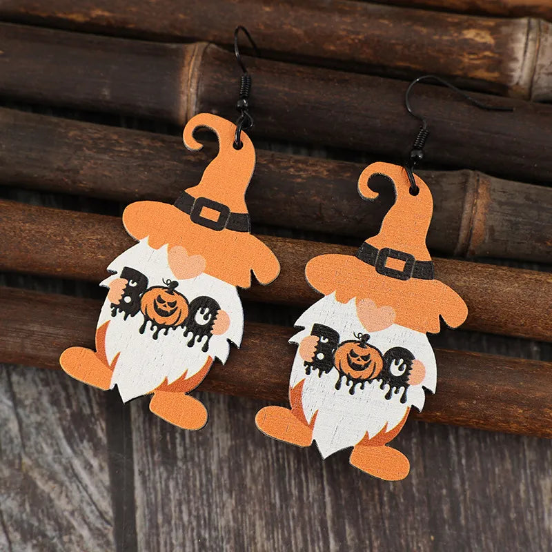 Wooden Dwarfs Pumpkin Dangle Earrings with autumn-themed design, featuring carved wood figures and dangling pumpkin accents.