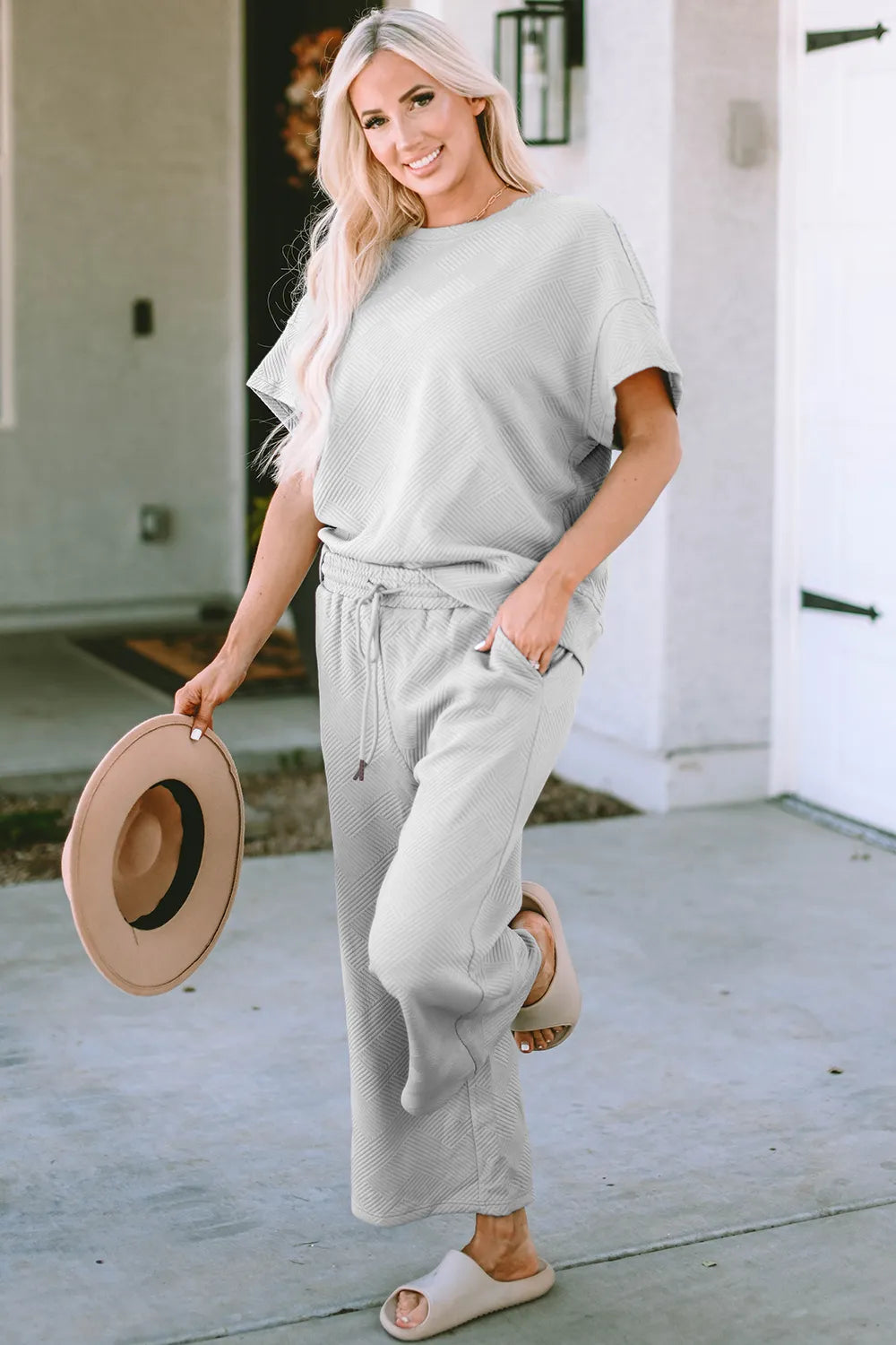 Trendsi double take full size texture short sleeve top and matching pants set, stylish casual outfit with textured fabric details.