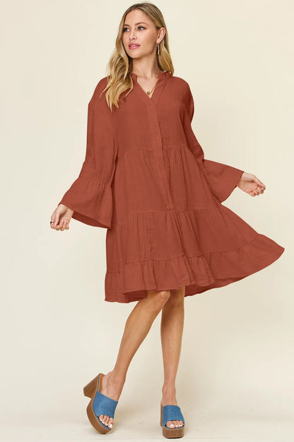 Plus size Trendsi Double Take full size textured button-up dress with ruffle hem, showcasing its stylish design and fabric details.