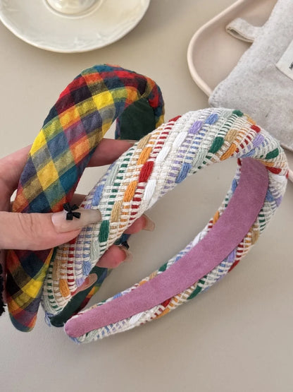 Colorful polyester hair headband with vibrant patterns, designed for stylish and comfortable hair accessory by Trendsi.