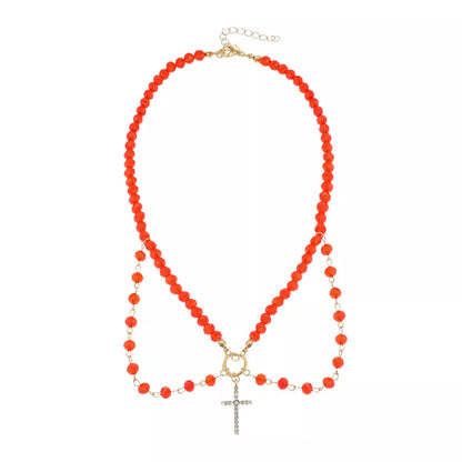 Halloween beaded cross pendant necklace from Trendsi featuring black beads and a silver cross charm on a chain.