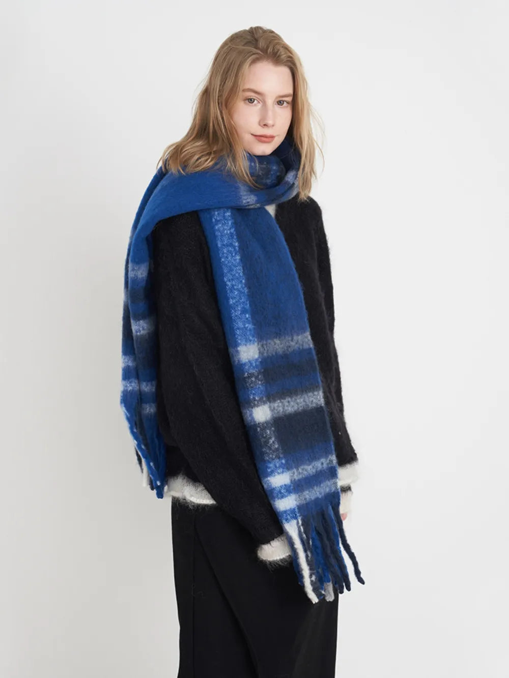 Fringe plaid polyester scarf with tassels, featuring a classic checkered pattern in neutral tones, ideal for stylish layering.