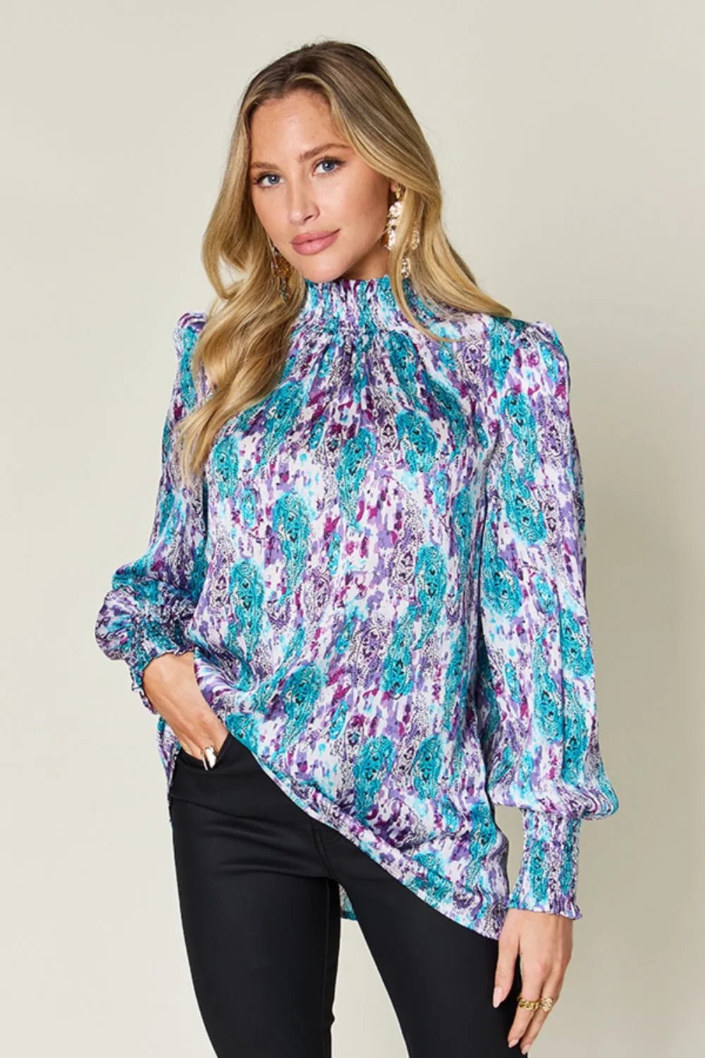 Printed smocked long sleeve blouse from Trendsi, featuring a full size double take design with a stylish, comfortable fit.