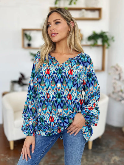 Printed balloon sleeve blouse from Trendsi featuring a double take full-size design and stylish balloon sleeves.