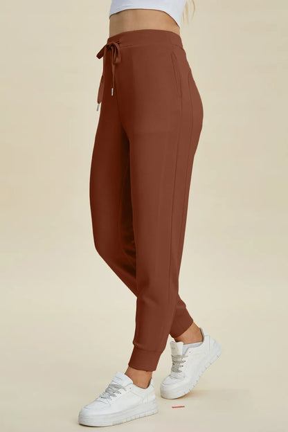 Basic Bae full size air scuba joggers by Trendsi with high waist, drawstring, and relaxed fit in a stylish casual look.