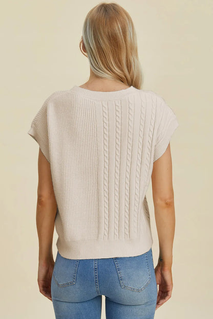 Plus size cable-knit round neck short sleeve sweater by Trendsi, showing the full size, cozy cable pattern, and classic knit texture.