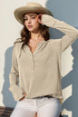 Long sleeve T-shirt by Trendsi with notched thumbhole design, featuring a casual fit and stylish long sleeves.