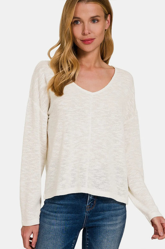 Zenana V-neck dropped shoulder long sleeve T-shirt in soft fabric, shown in black with relaxed fit and stylish design.