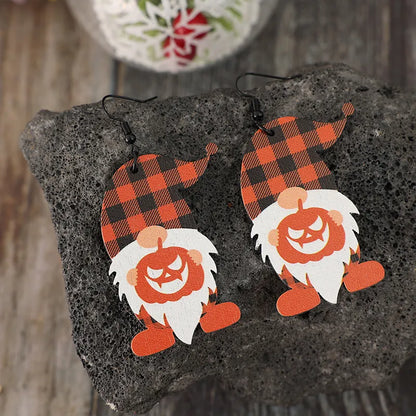 Wooden dwarf pumpkin dangle earrings featuring carved pumpkin design, perfect for fall or Halloween fashion accessories.