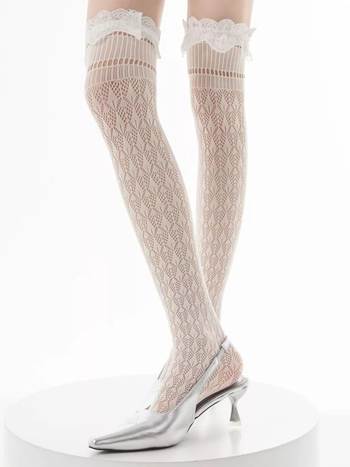 Lace over-the-knee hollow-out stockings from Trendsi showcasing intricate lace design and sheer hollow-out pattern.