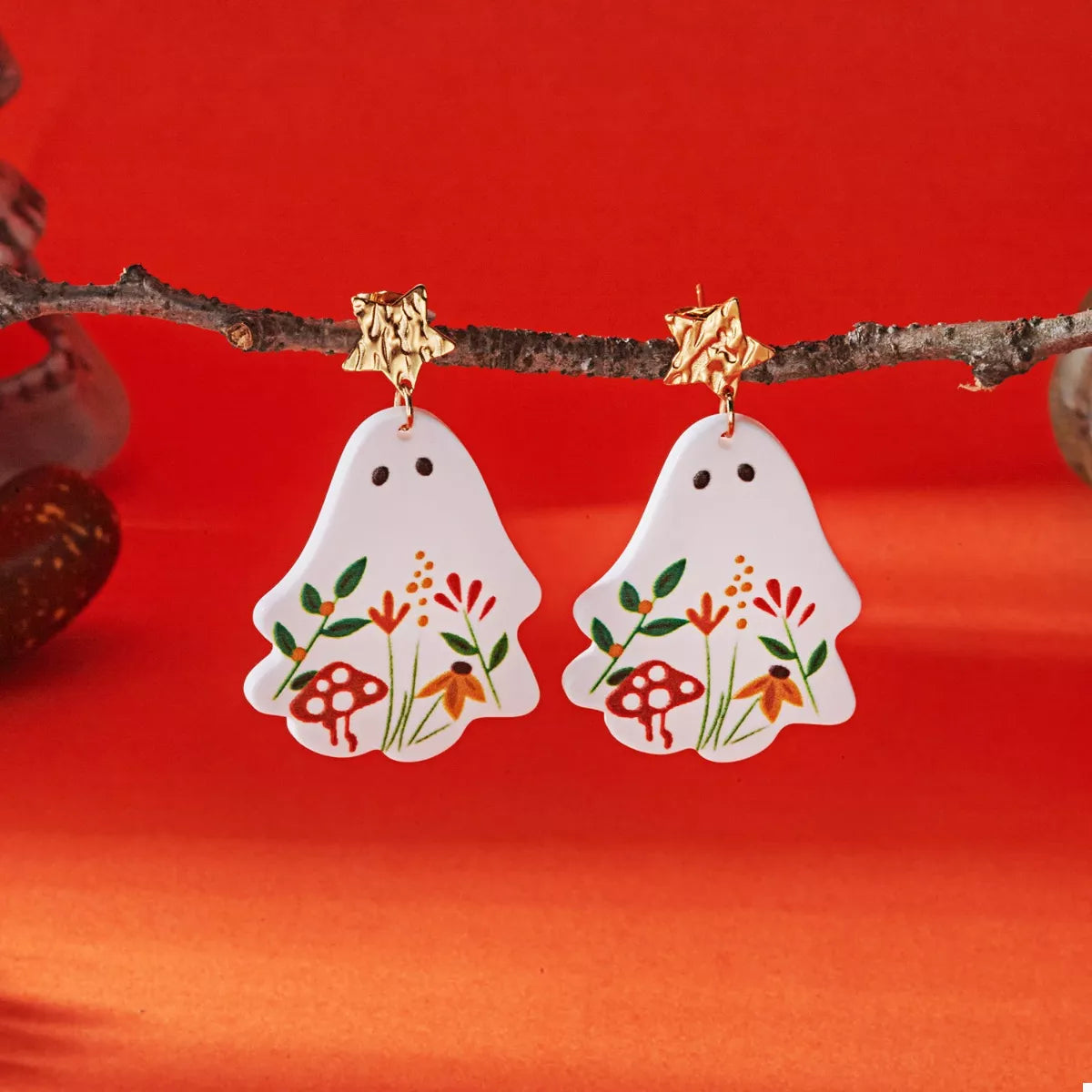 Whimsical ghost earrings with floral design, silver-tone dangle jewelry featuring playful ghost and flower motifs.