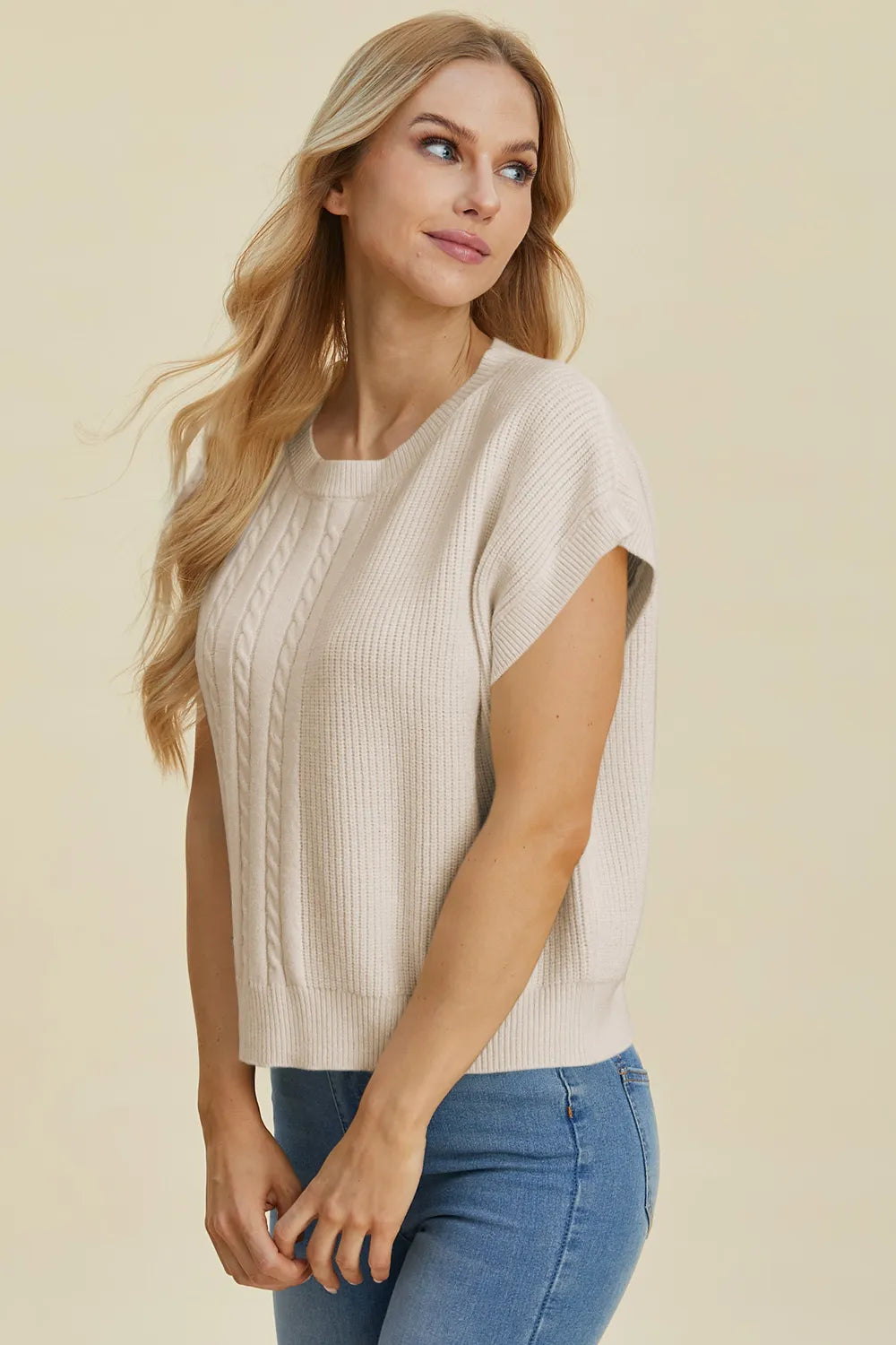 Plus size cable-knit round neck short sleeve sweater by Trendsi, featuring a double take full size fit and classic knit texture.