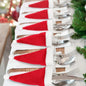 Set of 20 Christmas hat-themed cutlery holders by Trendsi, featuring festive red and green fabric with holiday patterns.