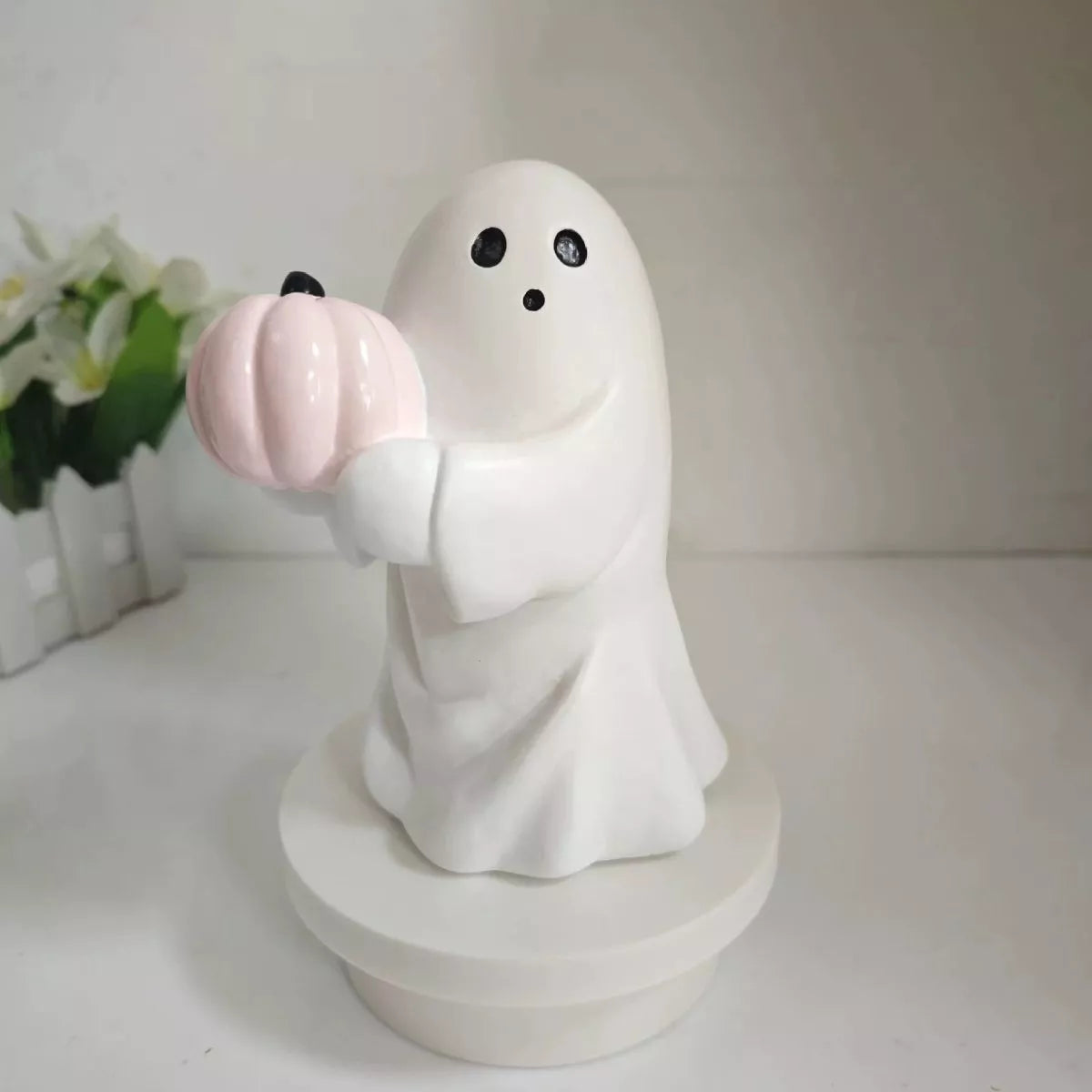 Halloween ghost decorative ornament by Trendsi featuring a spooky white ghost figure with black eyes and flowing fabric.