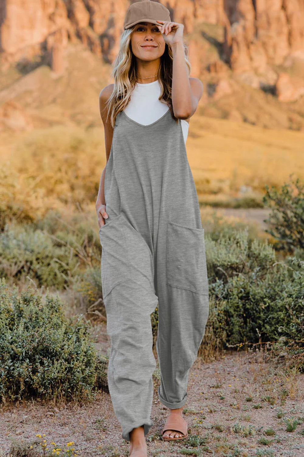 Front view of Trendsi Double Take full-size sleeveless V-neck jumpsuit with pockets, showcasing its stylish design and comfortable fit.
