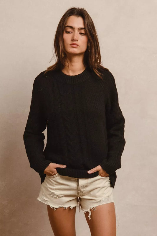 Trendsi BiBi Twist knitted open shoulder sweater in soft fabric with long sleeves and stylish twisted design.