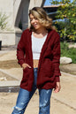 Full size Teddy hooded jacket with front pockets by Trendsi, soft faux fur material and cozy hood for cold weather comfort.