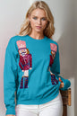 Trendsi Double Take full size nutcracker sequin long sleeve sweater with festive holiday design and colorful embellishments.