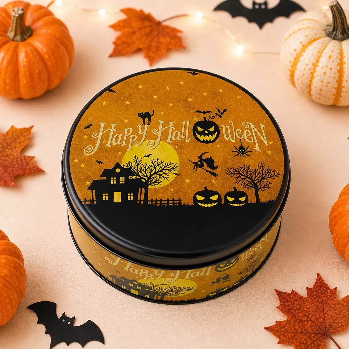 Halloween decorative metal candy tin with spooky pumpkin design, perfect for festive treat storage.