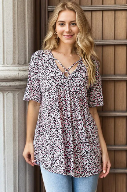 Heimish plus size short sleeve crisscross animal print babydoll top, stylish and comfortable women's fashion shirt.