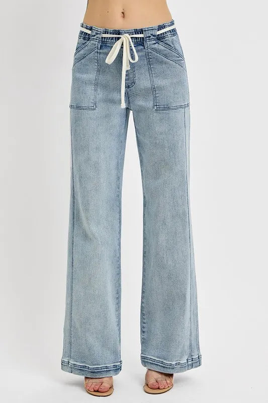 Plus size RISEN straight leg jeans with front and back pockets, casual denim style from Trendsi.