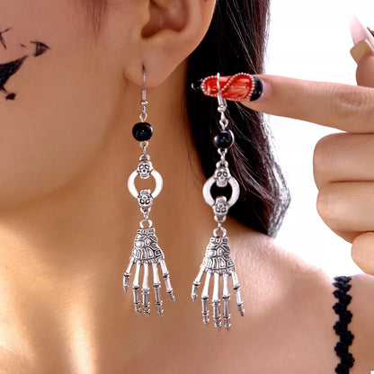 Halloween Skeleton Hand Drop Earrings featuring detailed skeleton hand design in silver-tone metal, perfect for spooky accessories.
