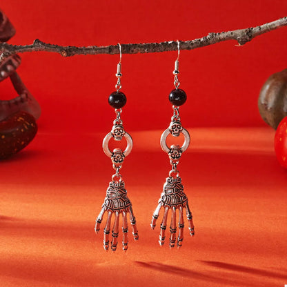 Halloween Skeleton Hand Drop Earrings featuring gothic-style skeletal hands hanging from silver hooks, perfect for spooky accessories.