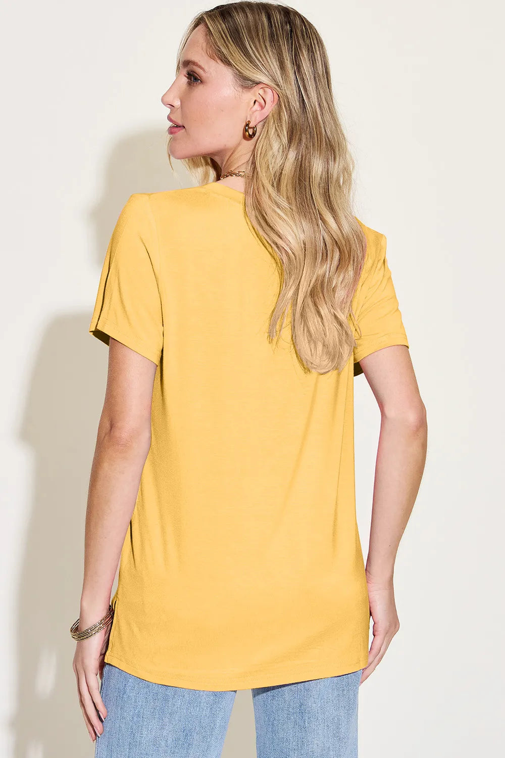 Basic Bae Bamboo V-Neck High-Low T-Shirt by Trendsi, full size, soft bamboo fabric, front V-neck, and high-low hem style.