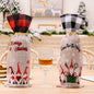 Two Christmas plaid wine bottle covers by Trendsi, featuring festive red and green patterns with a cozy holiday design.