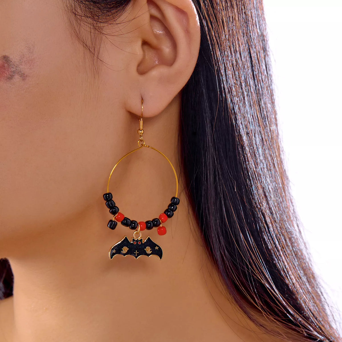 Halloween bat charm hoop earrings featuring black bat pendants on silver hoops, perfect for spooky seasonal accessories.